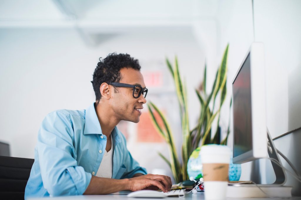 Young man working at computer in office